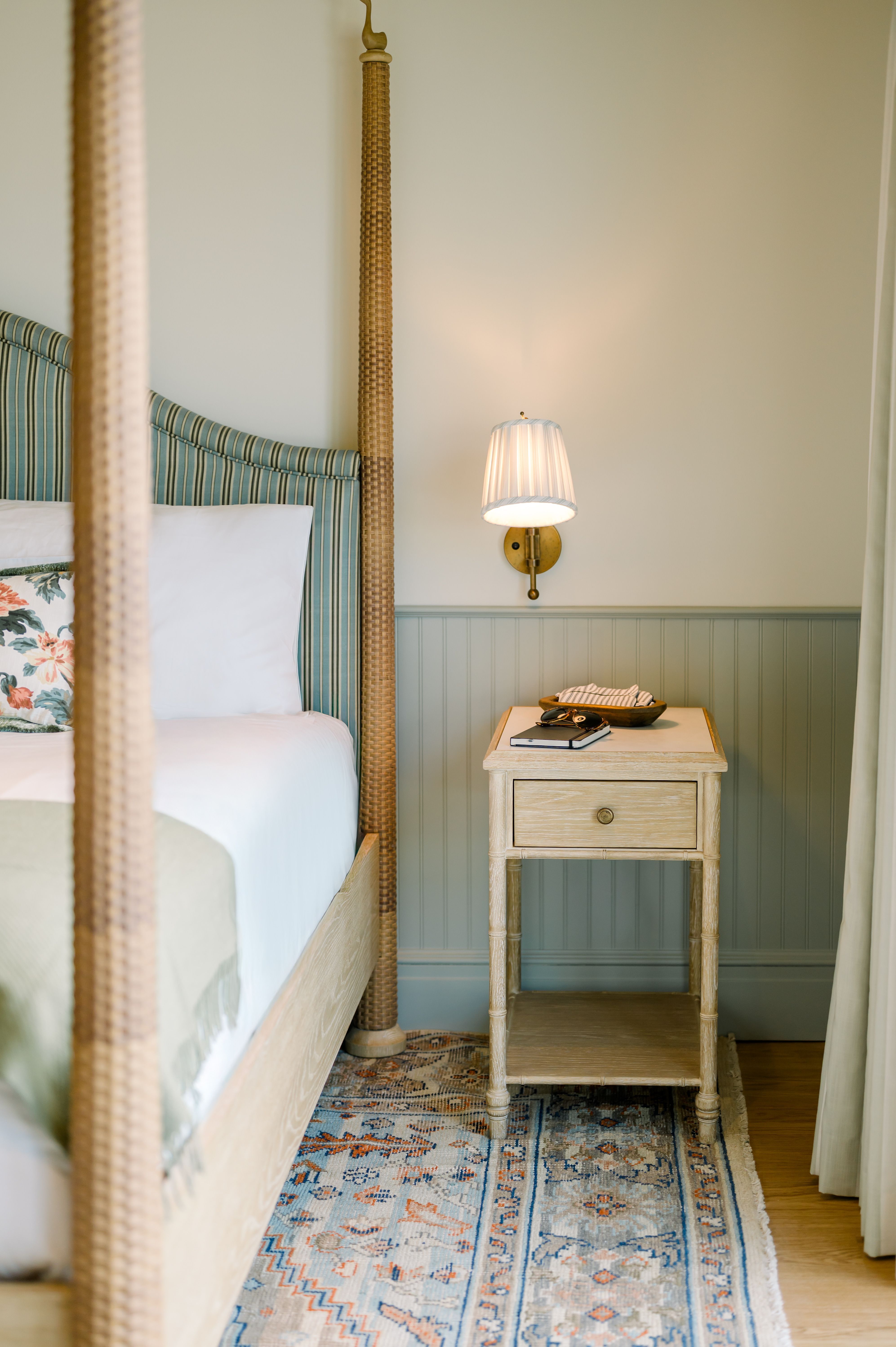 image Unwind beside the gentle glow of a bedside lamp in a space designed for restful simplicity.