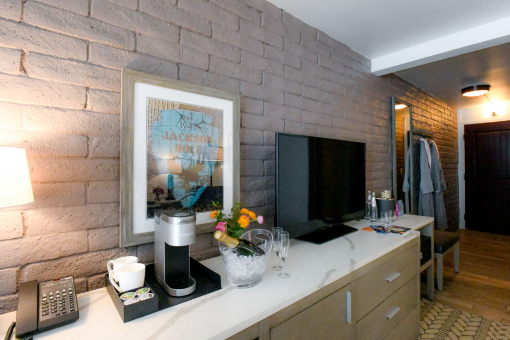 image Modern living space with chic brick accent wall and warm lighting