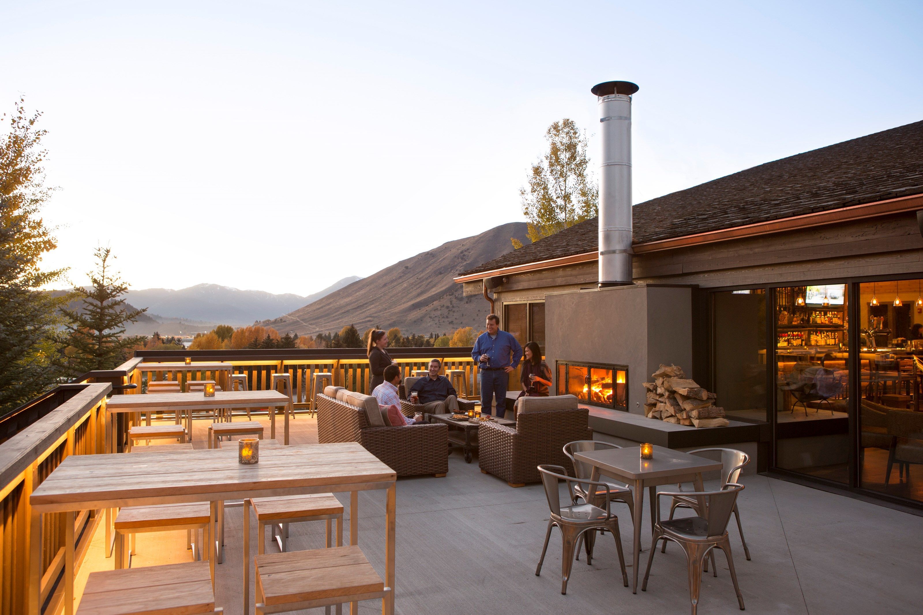 image Unwind on the spacious terrace with breathtaking mountain views and a perfect outdoor dining setup.