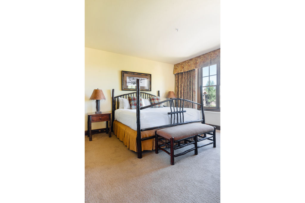 image Elegant master suite with luxurious king bed and sitting area.
