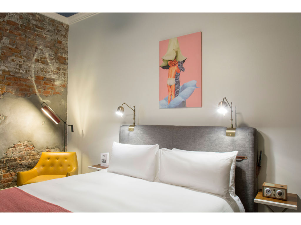 image Restful sleep space framed by artistic flair and brick wall texture