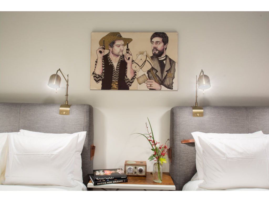 image Sleek bedroom elegance punctuated by unique wall art