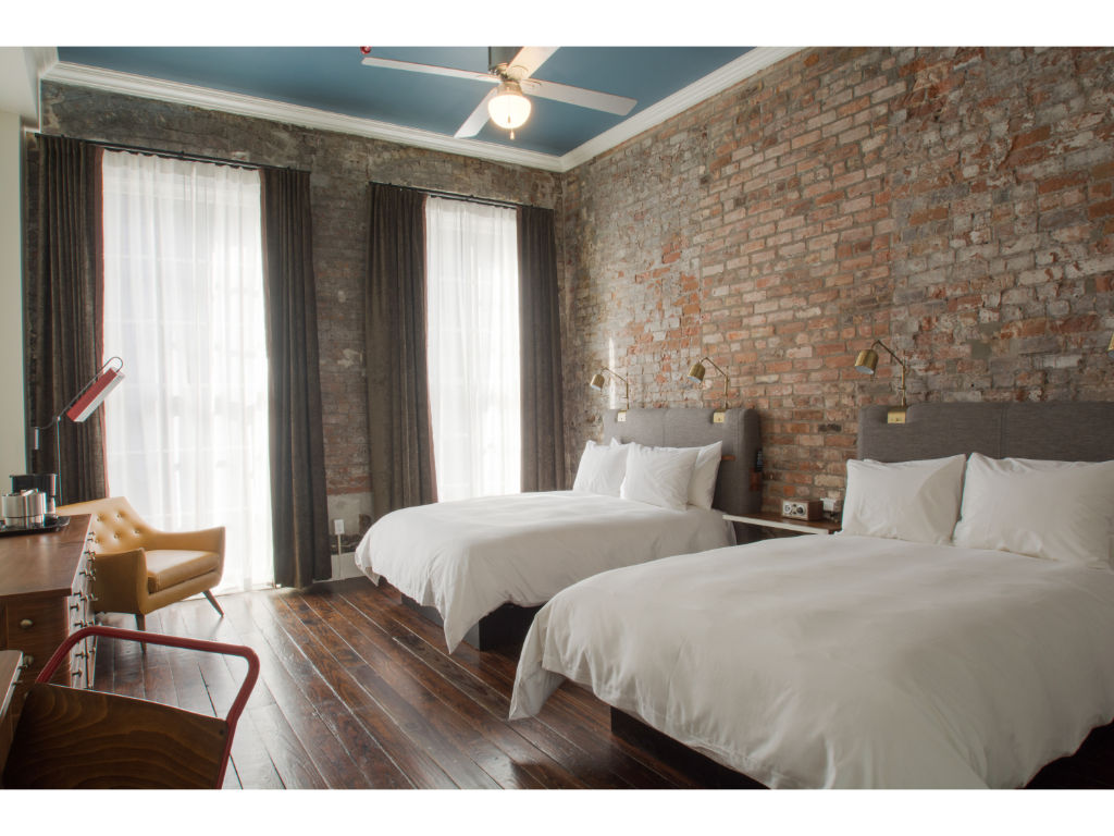 image Spacious bedroom blending natural textures with a contemporary edge