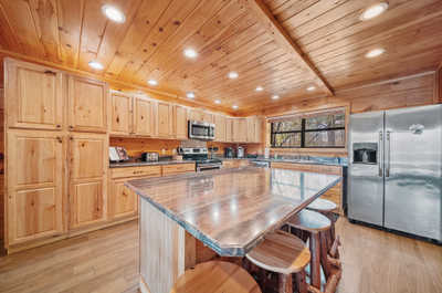 The heart of the home—a spacious kitchen island and dining area where guests can cook, dine, and share stories in a warm setting.