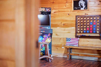 Where playful spirits meet—this game room boasts a classic arcade, nostalgic wall games, and space to lounge for your leisurely afternoons.