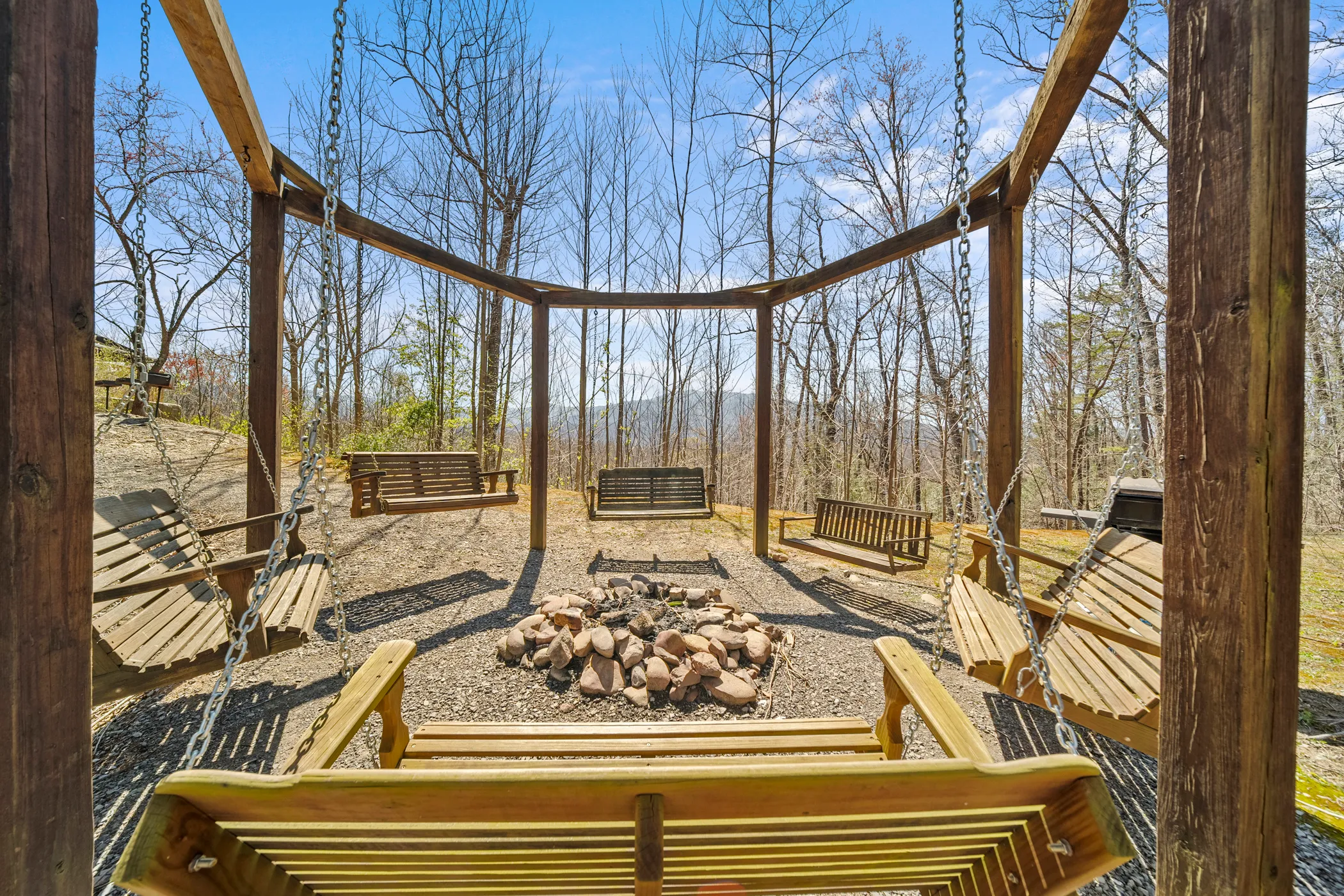 image Cozy up by the fire pit or sway on the porch swings, enveloped by nature and the peaceful ambiance of the Smokies.