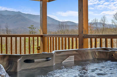 Stellar mountain views await as you relax in the hot tub, a serene spot for stargazing and soul-soothing soaks.