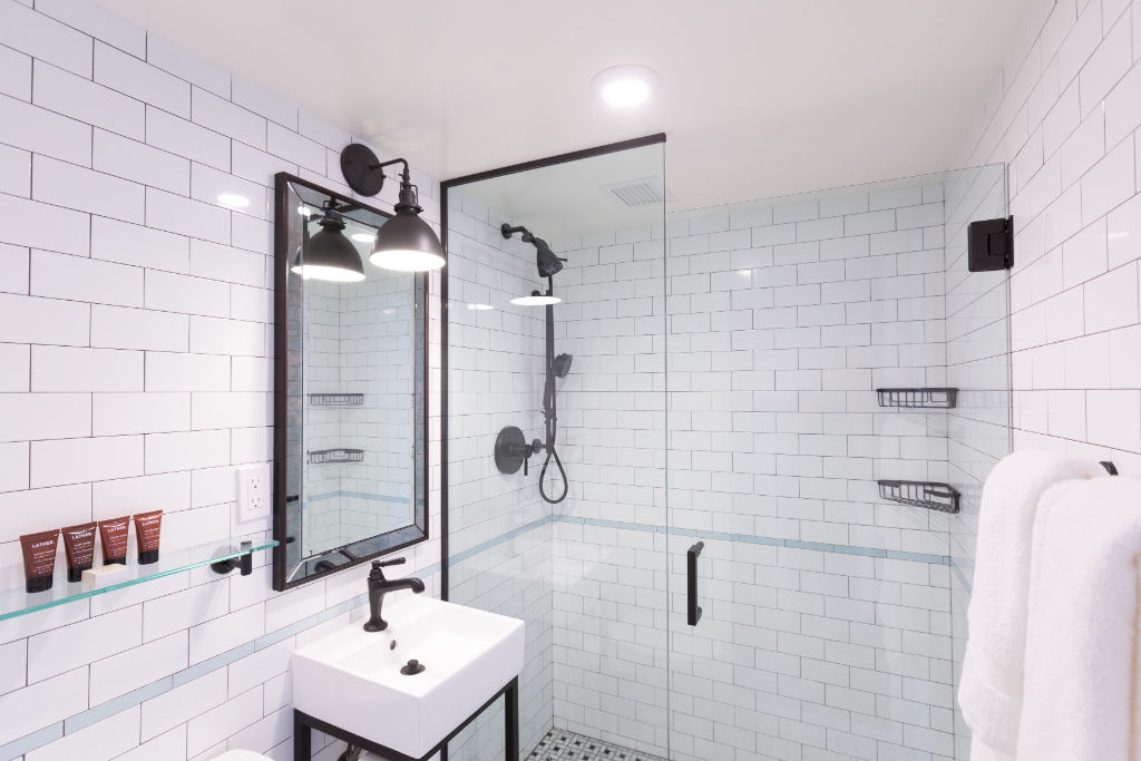 image Step into a refreshing oasis with this bathroom's clean lines, monochrome palette, and premium fixtures.