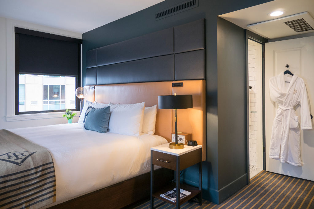 image Comfort meets sleek design in this bedroom, where every detail caters to a relaxing retreat.