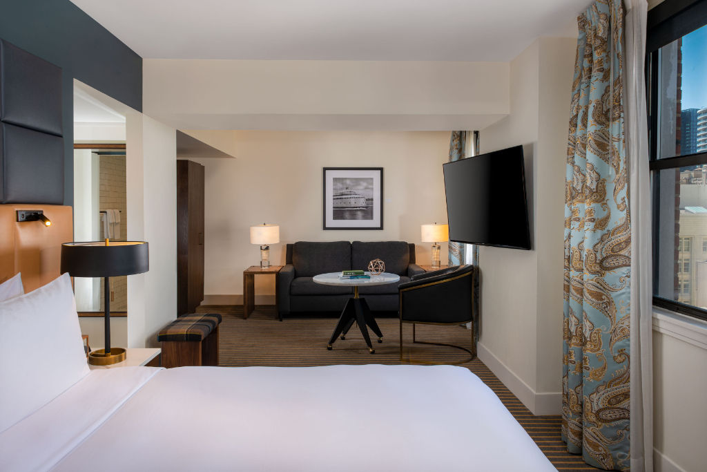 image Serene bedroom meets productivity with a dedicated workspace, enveloped in cozy elegance.