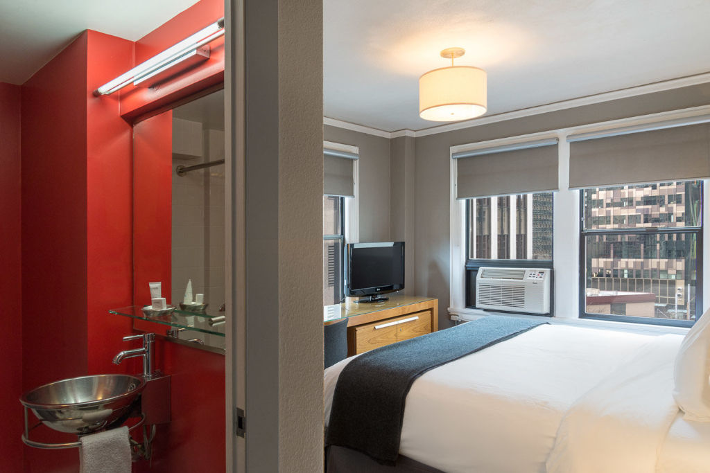 image Chic urban living, complete with striking reds and a skyline backdrop.