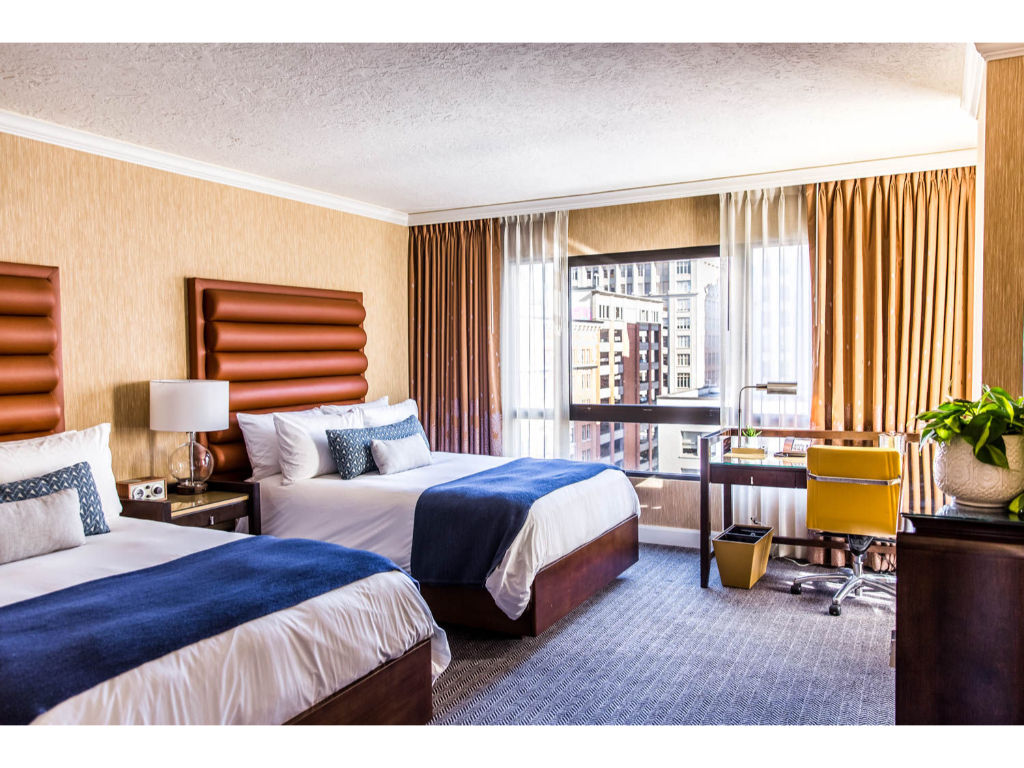 image Bright, comfortable space with two beds, offering a harmonious blend of convenience and style.