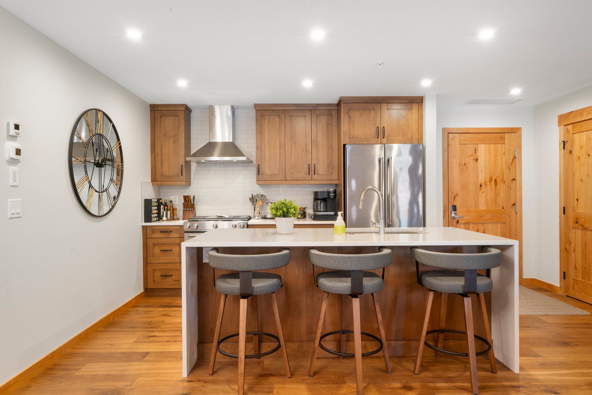 image Start your day at the stylish breakfast bar in our open kitchen, fully equipped for your culinary adventures, including a Keurig for your morning coffee.