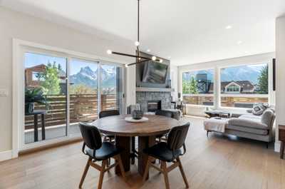 Enjoy family meals in the bright and airy dining area, featuring large windows with stunning mountain views.