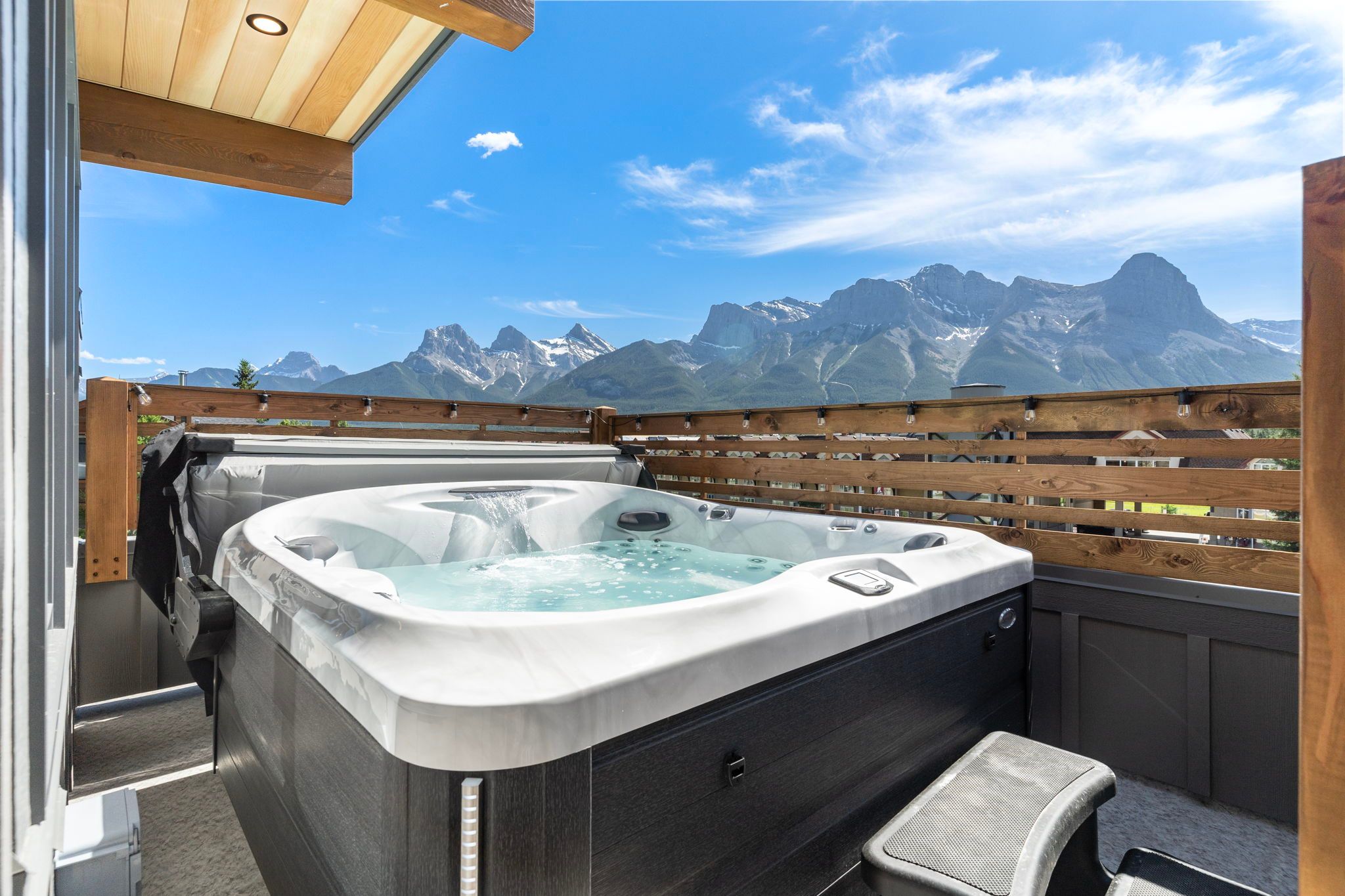 image Relax and unwind in the private hot tub with breathtaking views of the majestic Canadian Rockies.