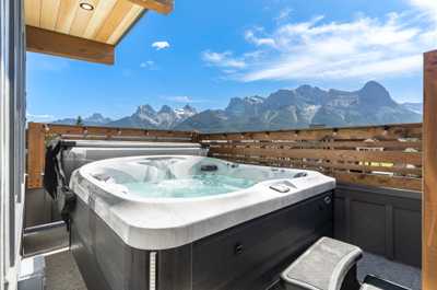 Relax and unwind in the private hot tub with breathtaking views of the majestic Canadian Rockies.