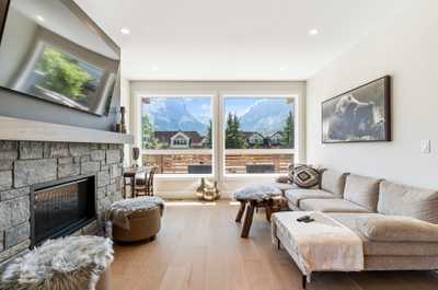 Gather around the gas fireplace in the inviting living room, designed for comfort and warmth.