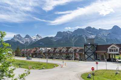 Stunning view of the majestic Canadian Rockies, showcasing the beautiful landscape surrounding the property.