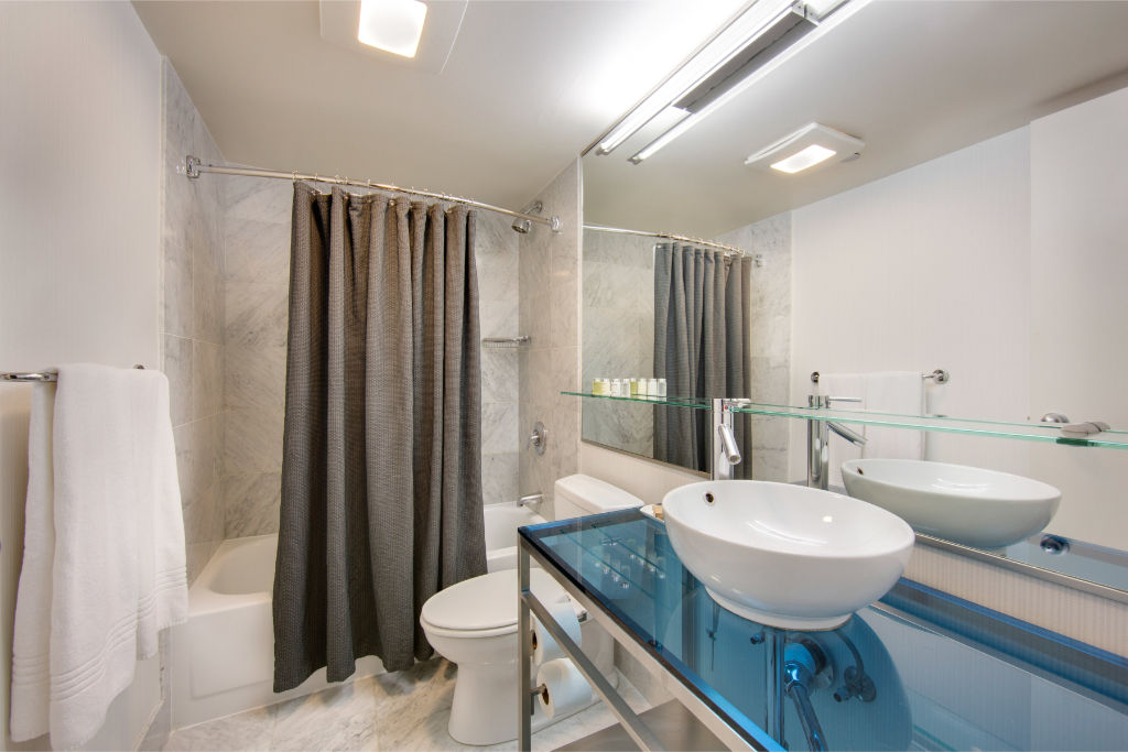 image Contemporary bathroom design with clean lines and neutral tones, offering a serene environment for unwinding.