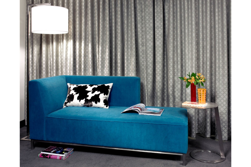 image Stylish lounge area with a striking sofa and modern decor, providing a vibrant space to relax or entertain.