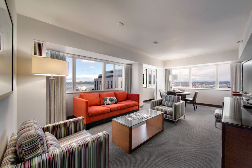 image Step into this spacious suite, where modern comforts meet sleek design, offering a panoramic view and a separate living area to maximize your stay.