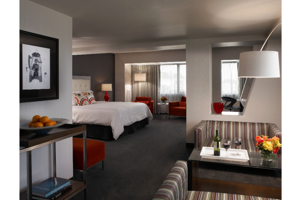 image Open suite layout ideal for families or extended stays, featuring comfortable living and sleeping areas.