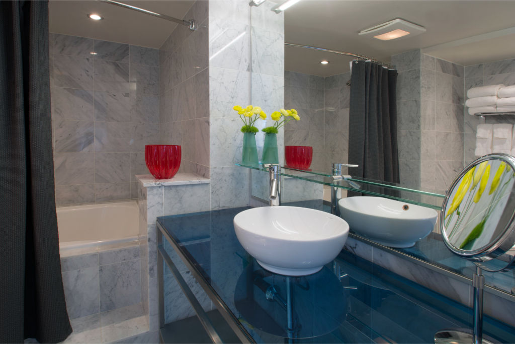 image Stylish bathroom with modern fixtures and vibrant floral accents.