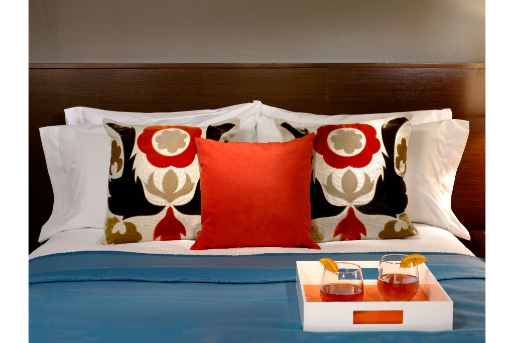 image Bold and bright bedroom design, featuring eye-catching accents and a vibrant setting for an energized stay.