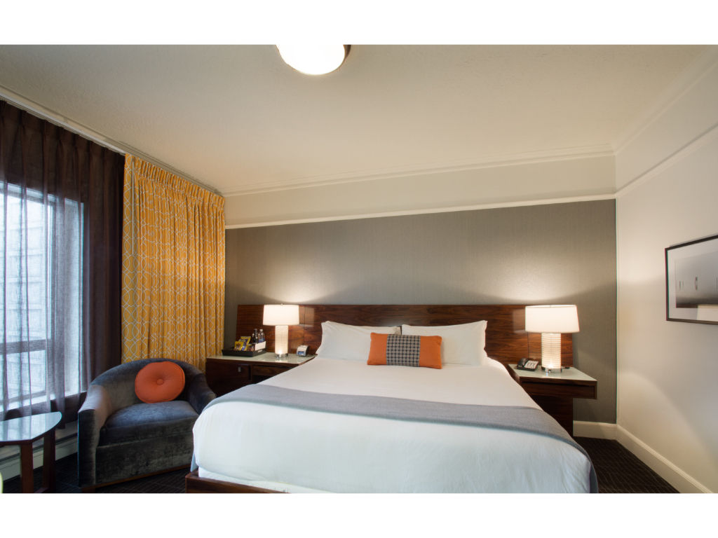 image Sleek and spacious premium room with a king bed, designed for supreme comfort and a luxurious stay.