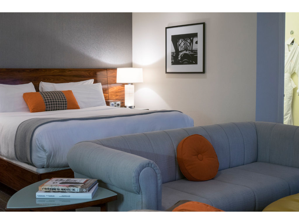 image Junior Suite with a king bed and a cozy sofa bed, offering versatile sleeping arrangements in a stylish setting.