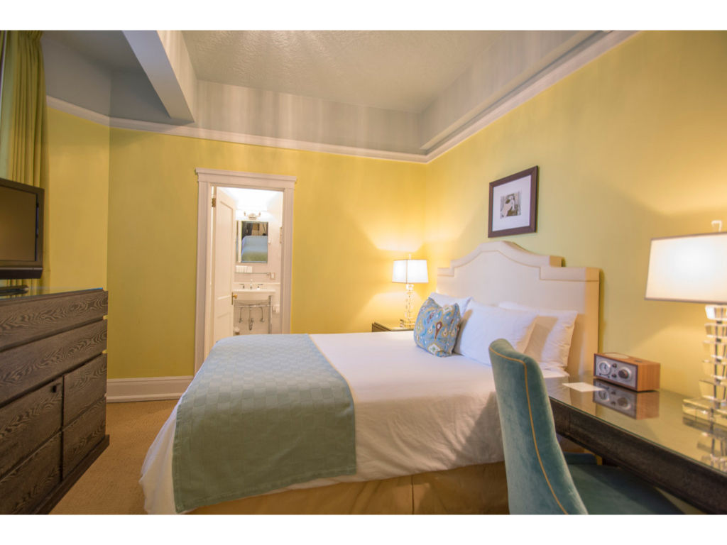 image Our comfortable queen room offers modern amenities, cozy bedding, and a peaceful environment for a perfect night's sleep.