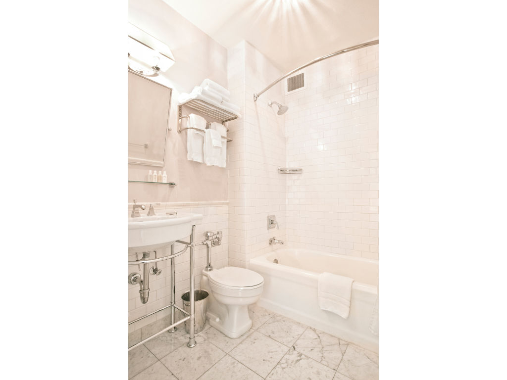 image Our well-appointed bathroom offers modern fixtures, a spacious layout, and all the essentials for your convenience.