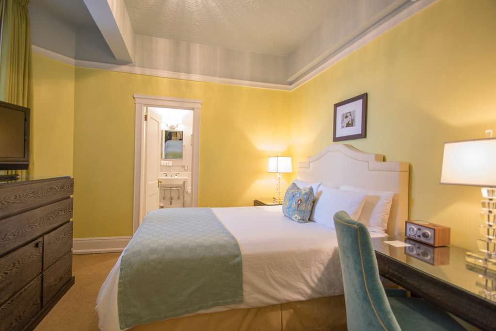 image Spacious queen room designed for relaxation, featuring contemporary furnishings and a serene atmosphere.