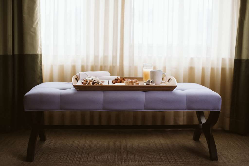 image Experience ultimate relaxation with our in-room massage service, set in a serene and calming environment.