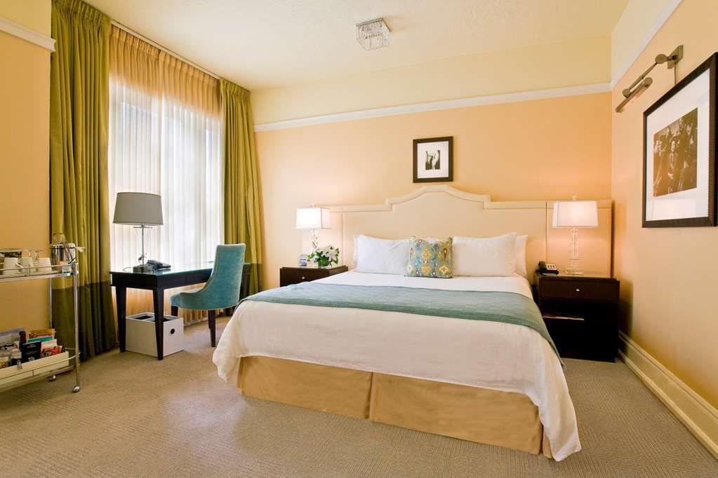 image Elegant room featuring a comfortable king bed, tasteful decor, and soft lighting for a restful sleep.