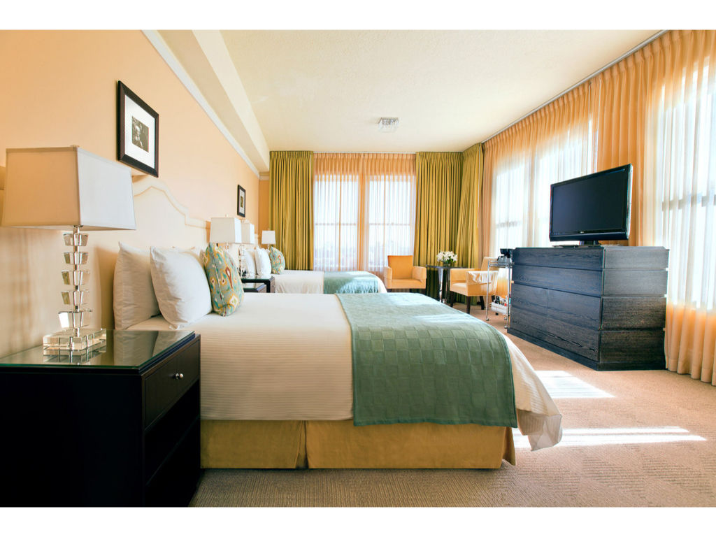 image Our stylish double queen room provides the perfect blend of comfort and luxury for a rejuvenating stay.