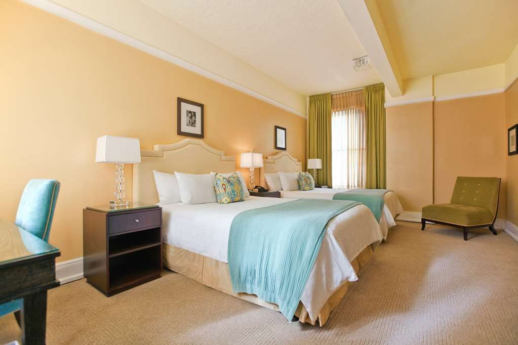 image Experience tranquility in our elegantly designed room with two queen beds, perfect for a comfortable and restful night.