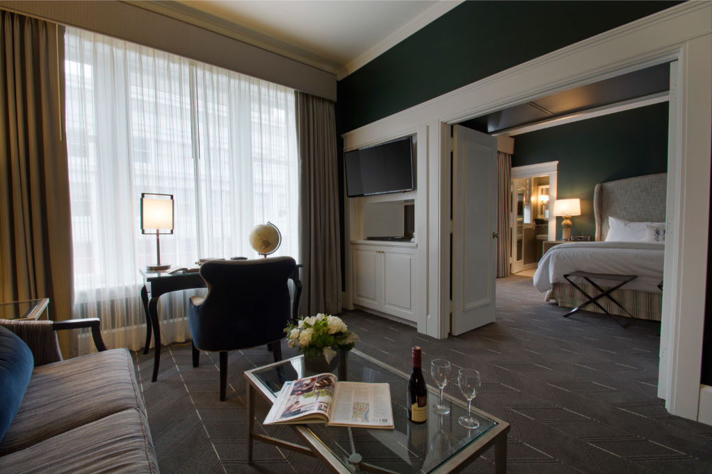 image Enjoy the open-concept suite with a cozy living area and a separate bedroom, providing privacy and comfort for your stay.