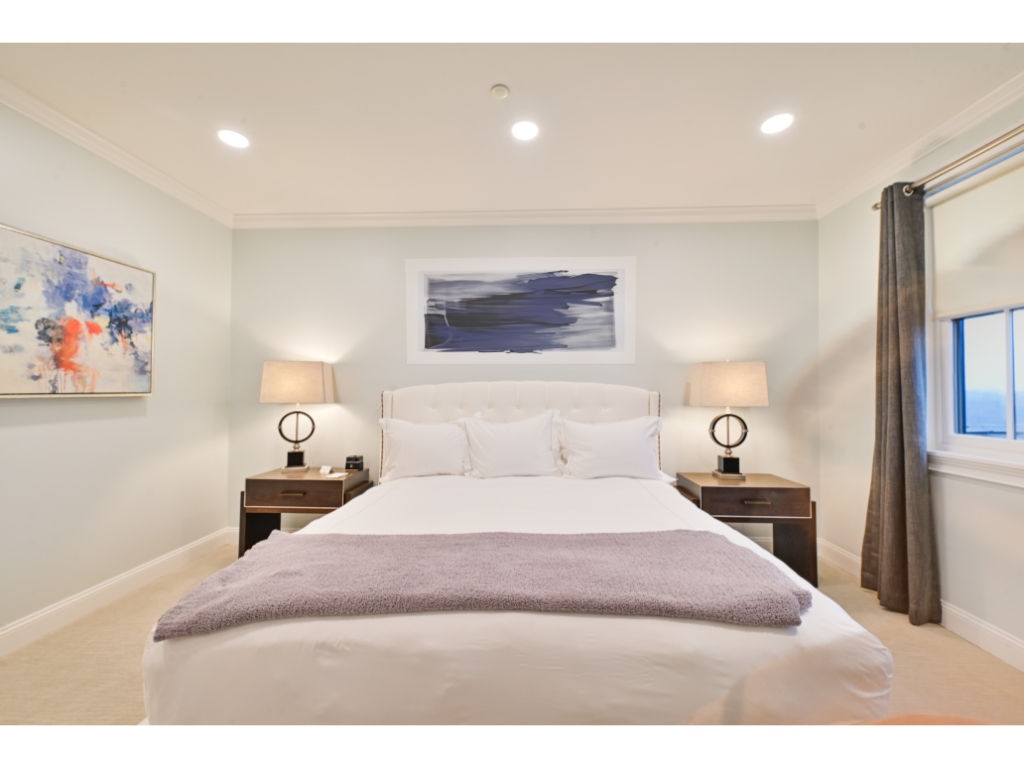 image Elegant bedroom with a comfortable plush bed and serene ambiance for a restful night's sleep.