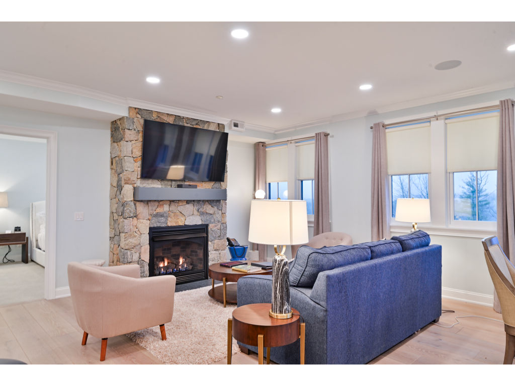 image Cozy living room with a warm fireplace and stylish decor - perfect for relaxing after a day of exploring.