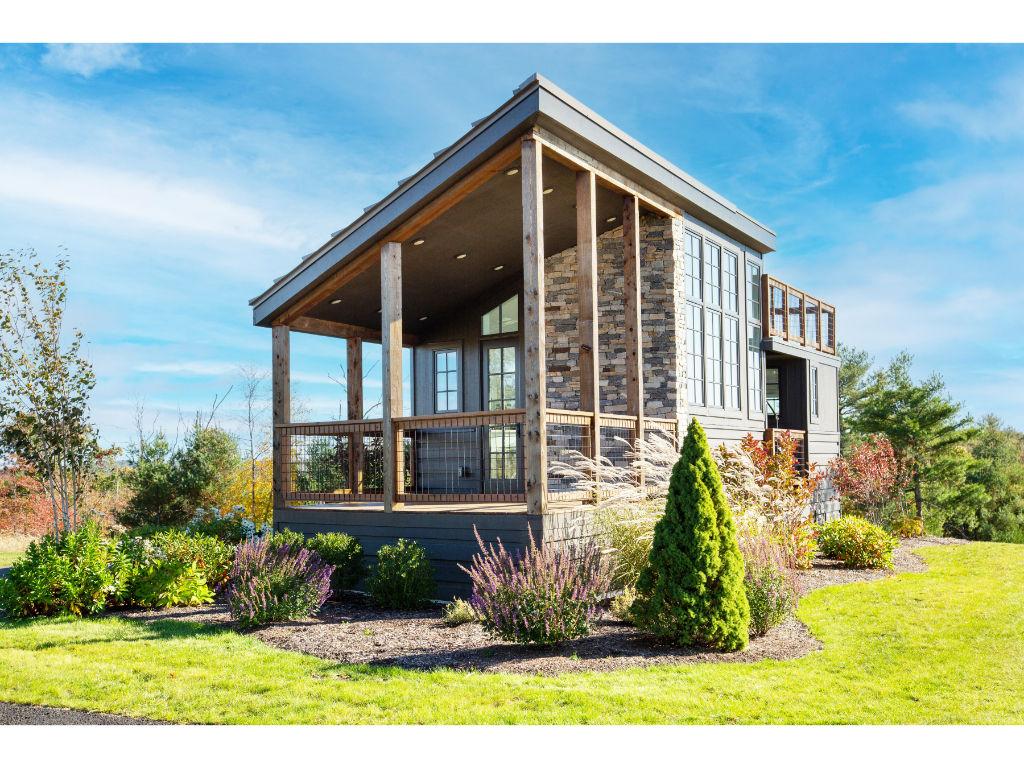 image Enjoy this delightful cottage surrounded by lush greenery and stunning landscapes, perfect for a serene getaway.