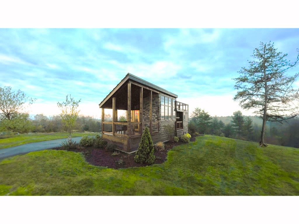image Escape to this quaint retreat offering expansive views of the open countryside, ideal for relaxation and rejuvenation.