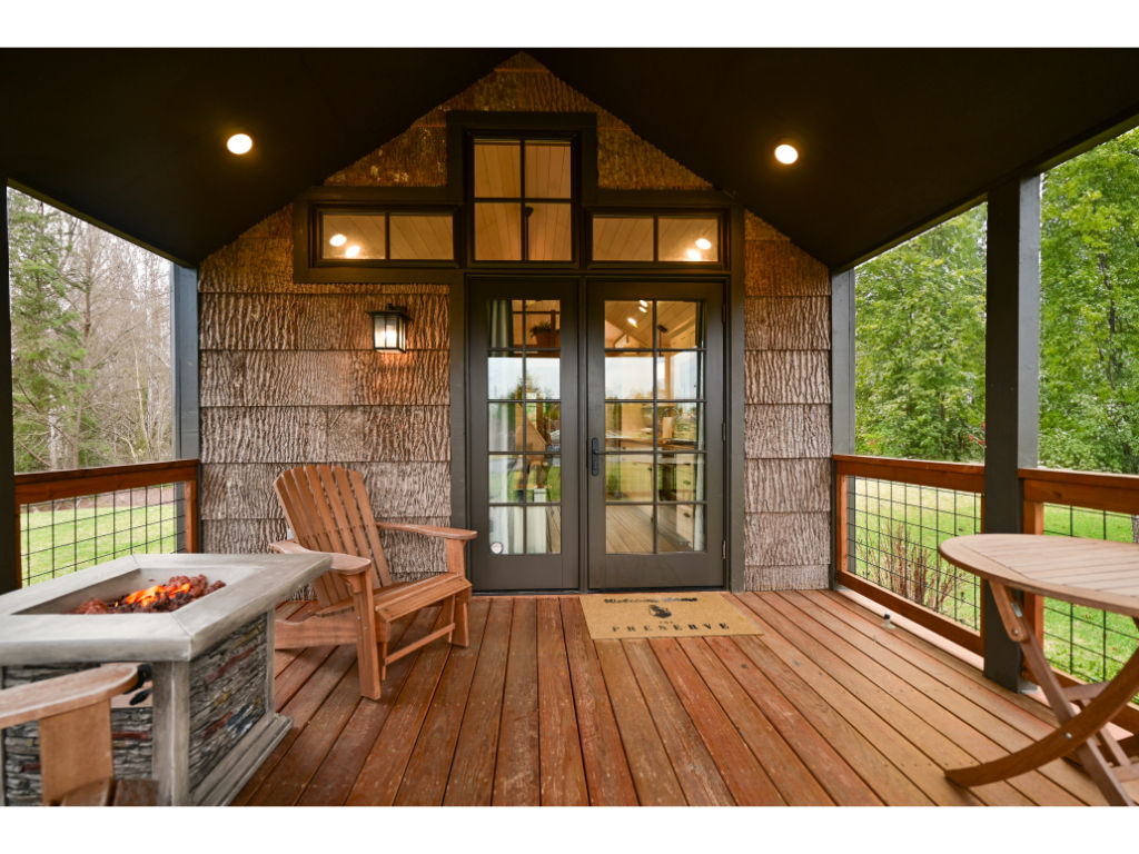 image Unwind on the charming porch, offering a peaceful retreat and beautiful views of the surrounding nature.