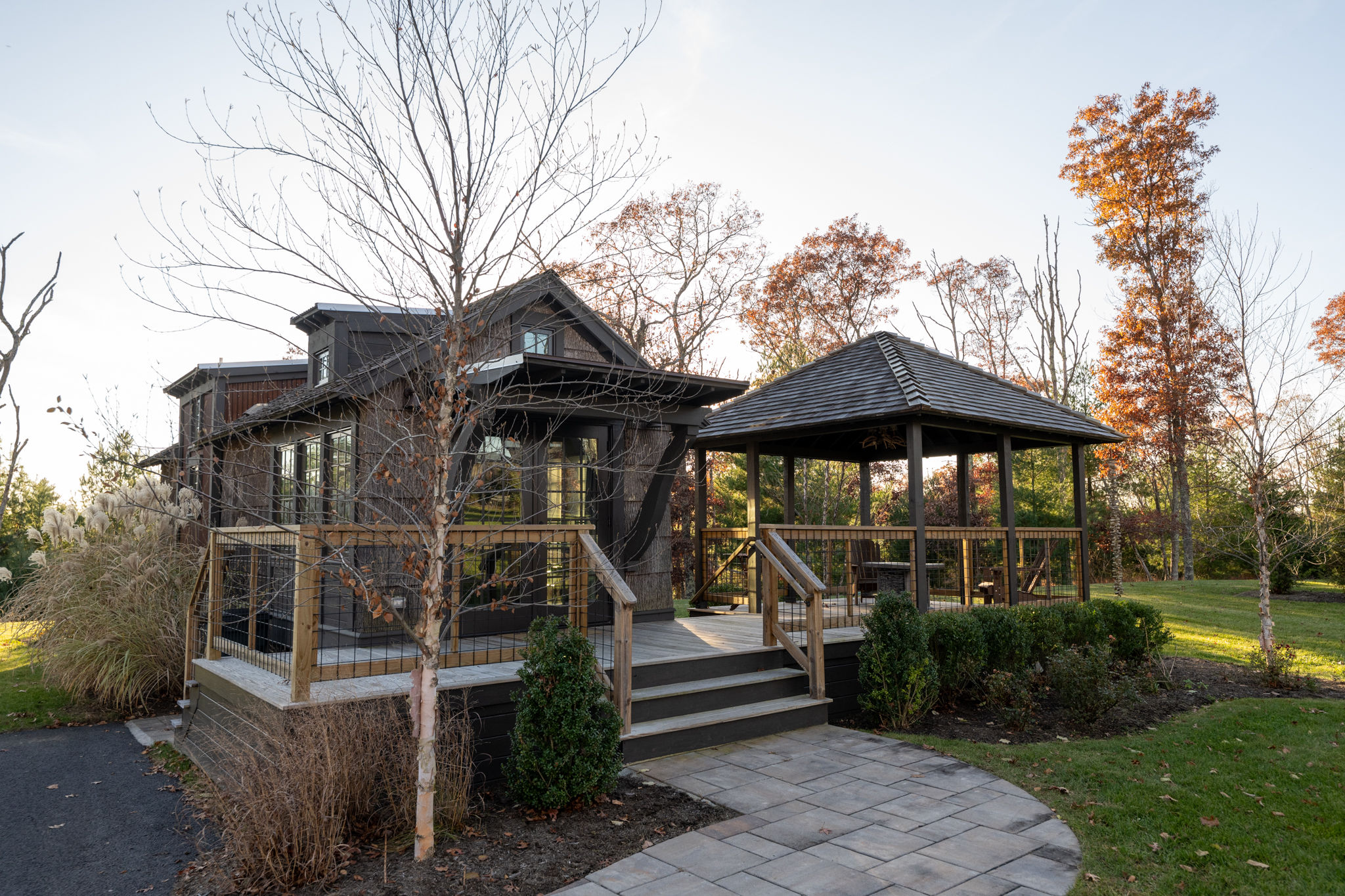 image Delight in the inviting charm of this tiny home, complete with a serene gazebo perfect for outdoor relaxation.