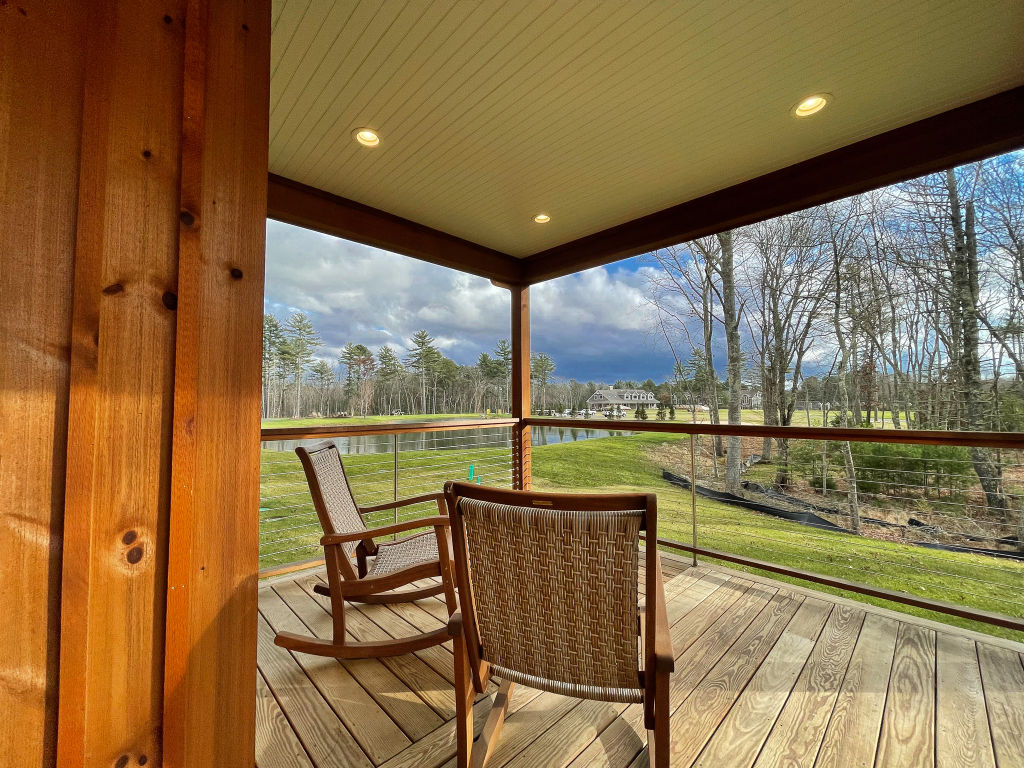 image Charming covered patio with scenic views of the surrounding nature.