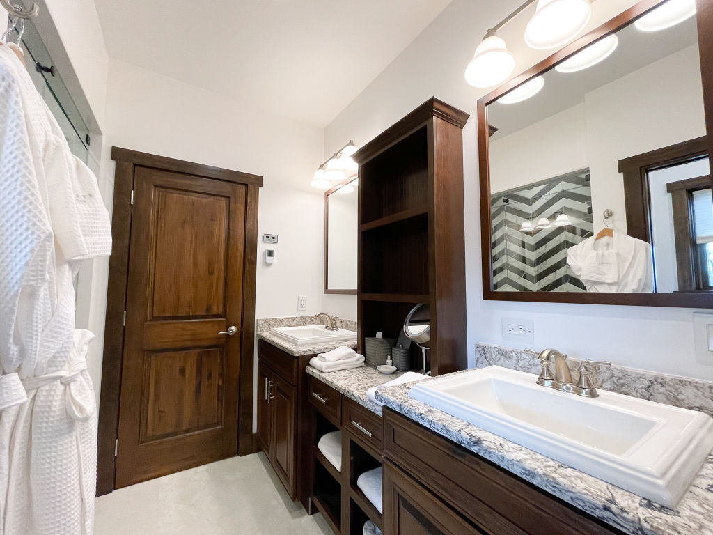 image Elegant bathroom with modern fixtures and a granite countertop.