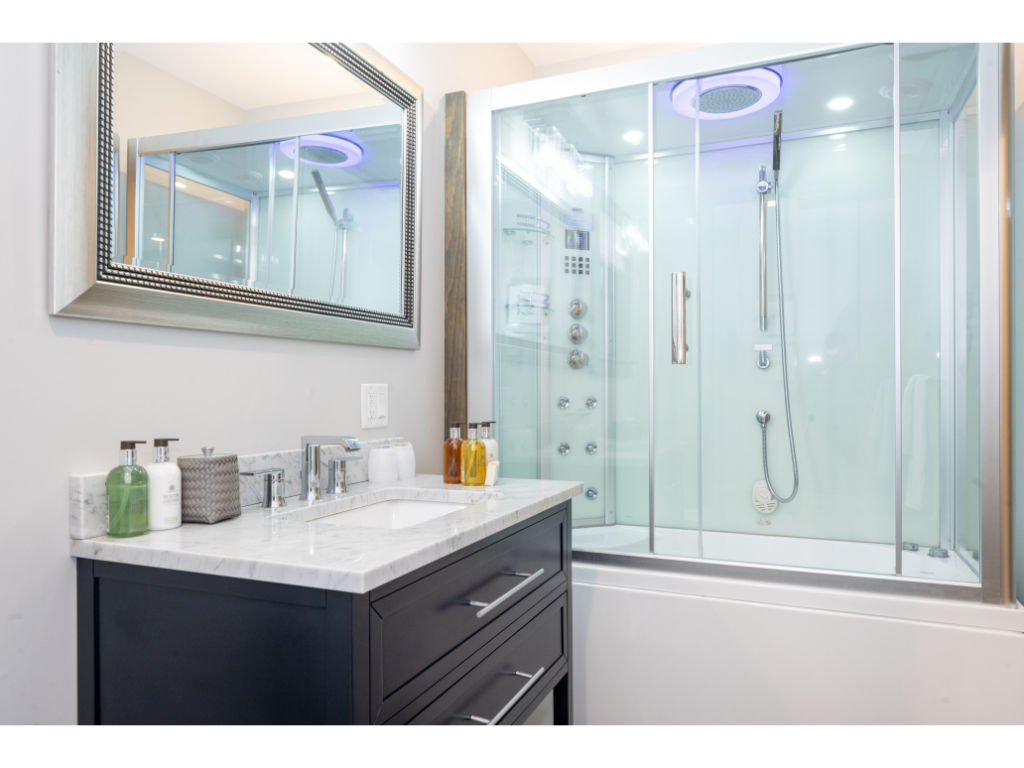 image Elegant bathroom featuring a luxurious shower and tub combination with modern fixtures and ambient lighting for a relaxing experience.