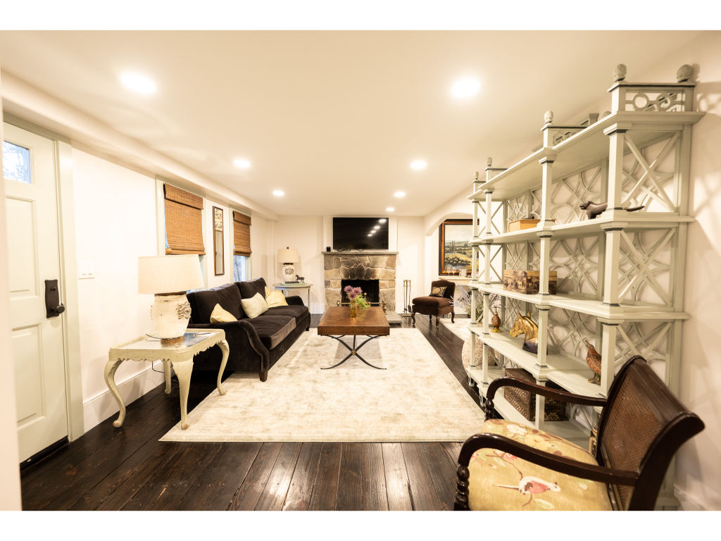 image Gather with family and friends in this expansive dining room, designed for comfort and memorable meals.