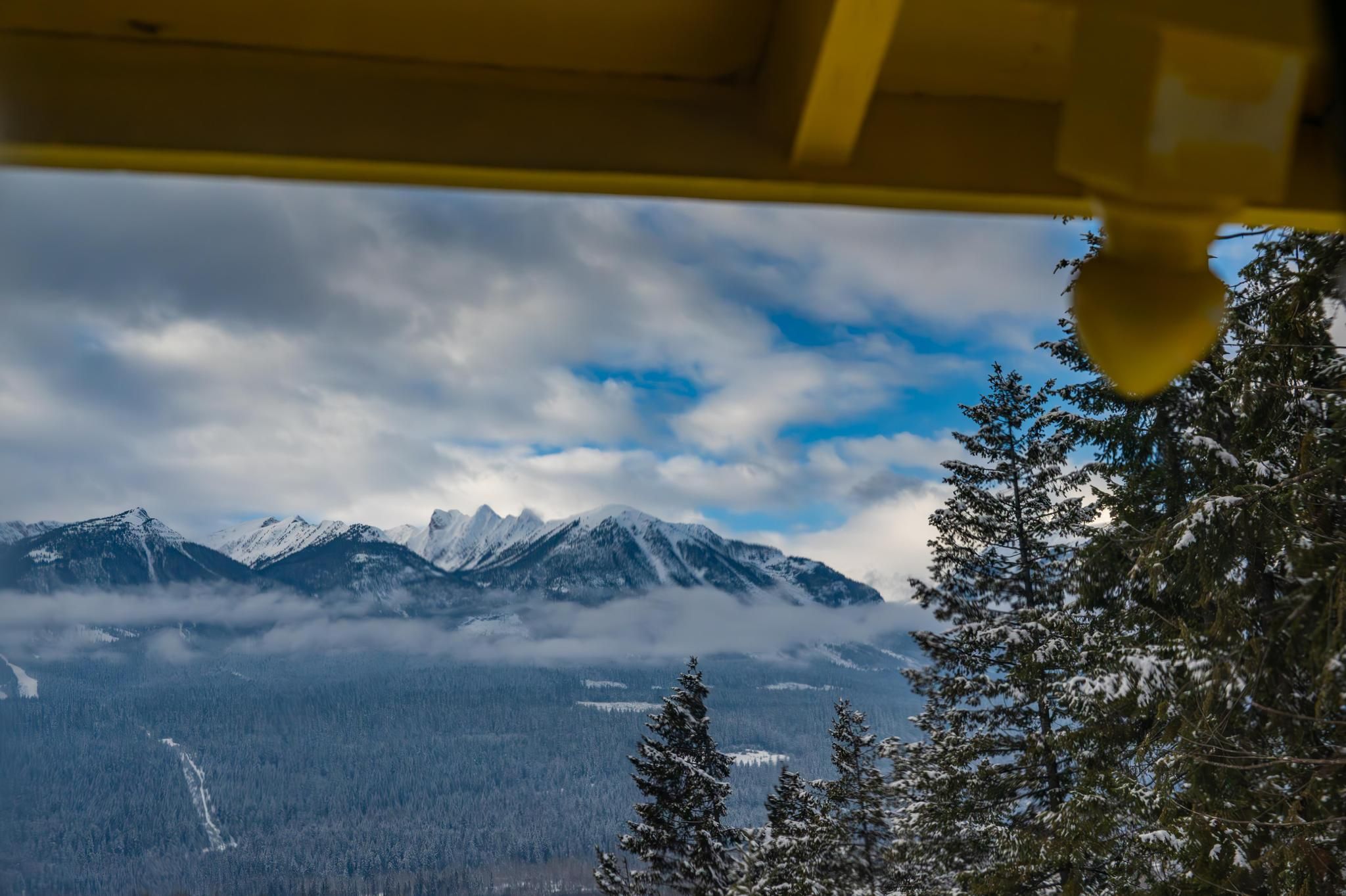 image Expansive mountain views from the chalet's deck, inviting you to unwind and connect with nature.