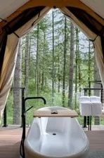 image Enjoy a luxurious bath in the heart of nature with this unique outdoor soaking tub.